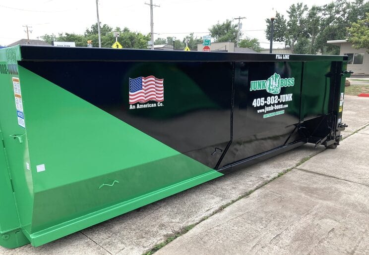 Roll-off dumpster rental from Junk Boss positioned at a job site in Oklahoma City, Oklahoma.